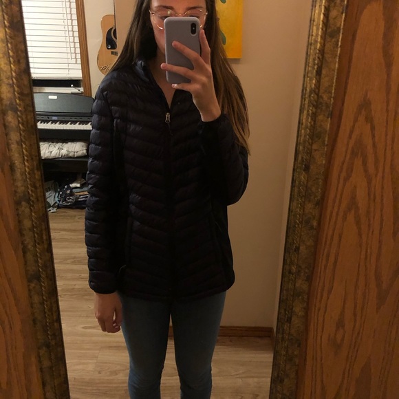 Navy blue puffy jacket with black details. - Picture 1 of 3